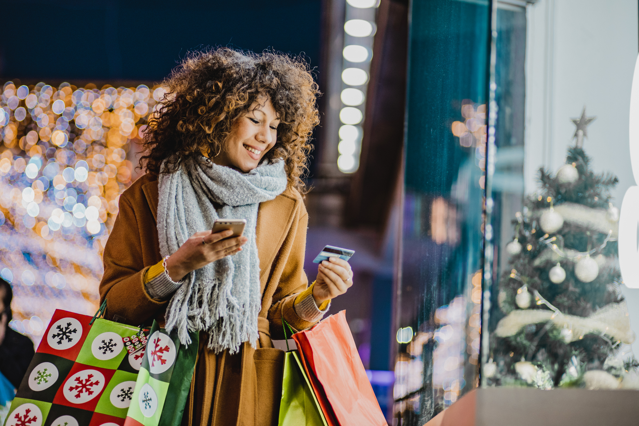 Young woman shopping for Christmas Young woman shopping for Christmas