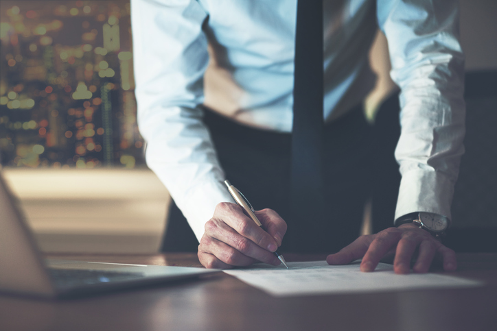 Close up business man signing contract Close up business man signing contract