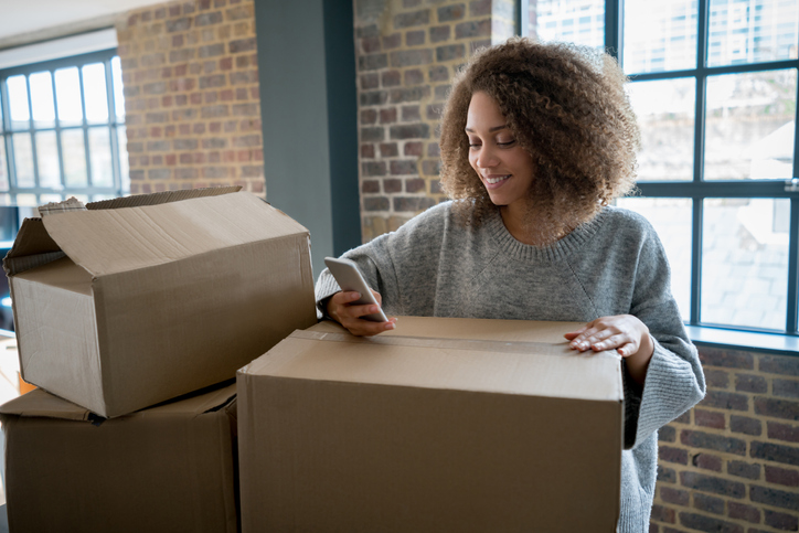 Happy woman moving house Happy woman moving house