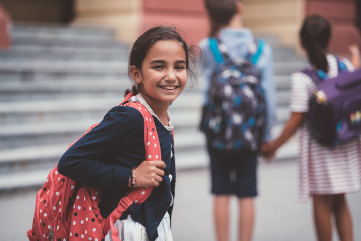 Schoolgirl smiling to camera