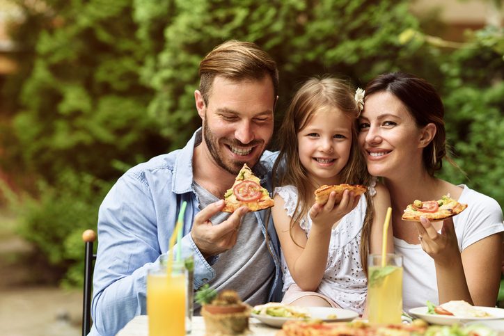 Happy Family eating outdoors