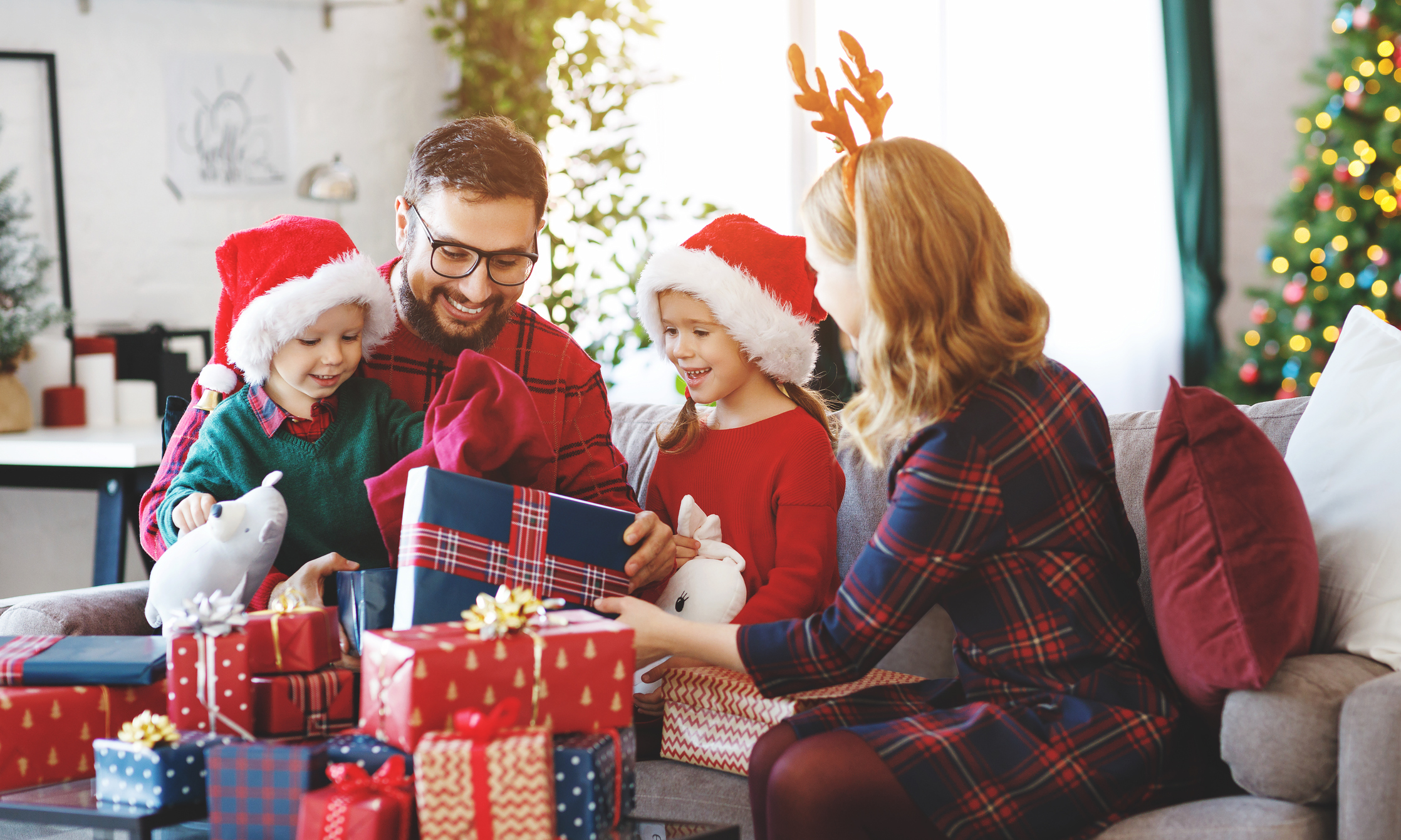 happy family   open presents on Christmas morning